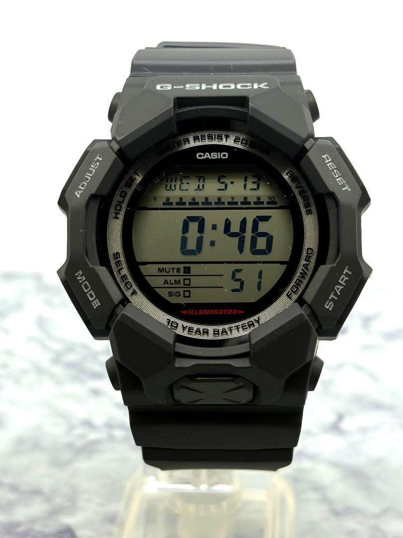Casio G-Shock GD-010 digital watch with carbon core design and silicone strap shown with original box and manual