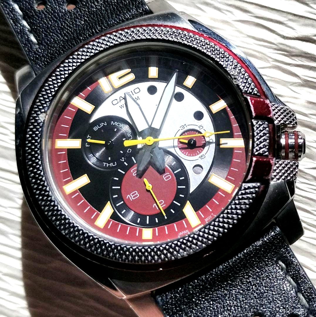 Casio men's quartz watch with black and red dial, stainless steel case, and leather strap