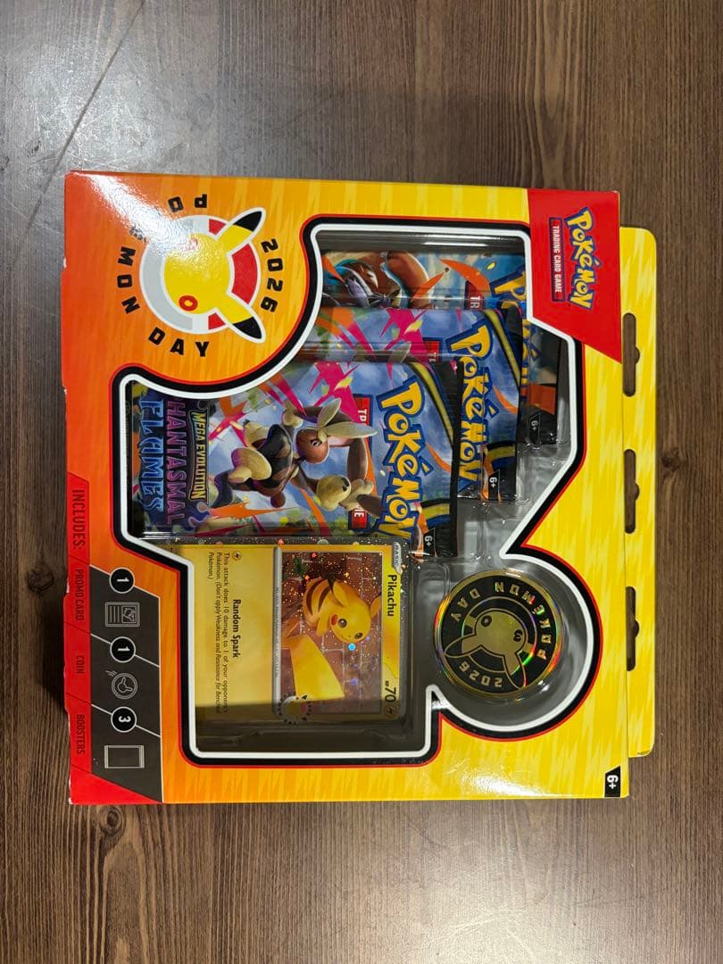 Unopened Pokemon Day 2026 Collection Box Japan Import showing promo card, special coin, and three expansion packs in English