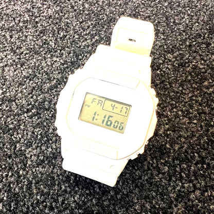 Casio G-Shock white digital watch collaboration with Kinashi Cycle showing front display and band