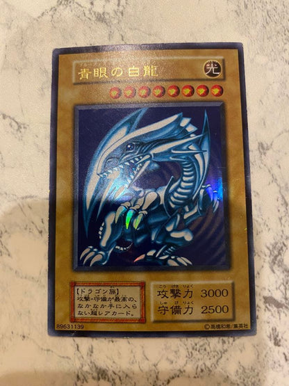 Yu-Gi-Oh! Blue-Eyes White Dragon Initial Edition Monster Card from Duel Monsters series in amateur storage