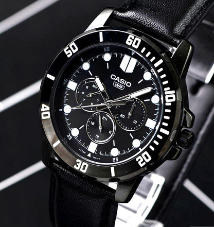 Casio import black metallic multi-function watch with leather band showing date and day calendar
