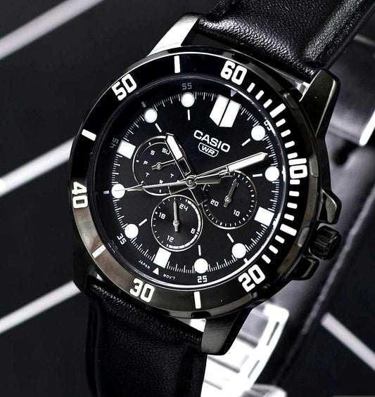 Casio import black metallic multi-function watch with leather band showing date and day calendar