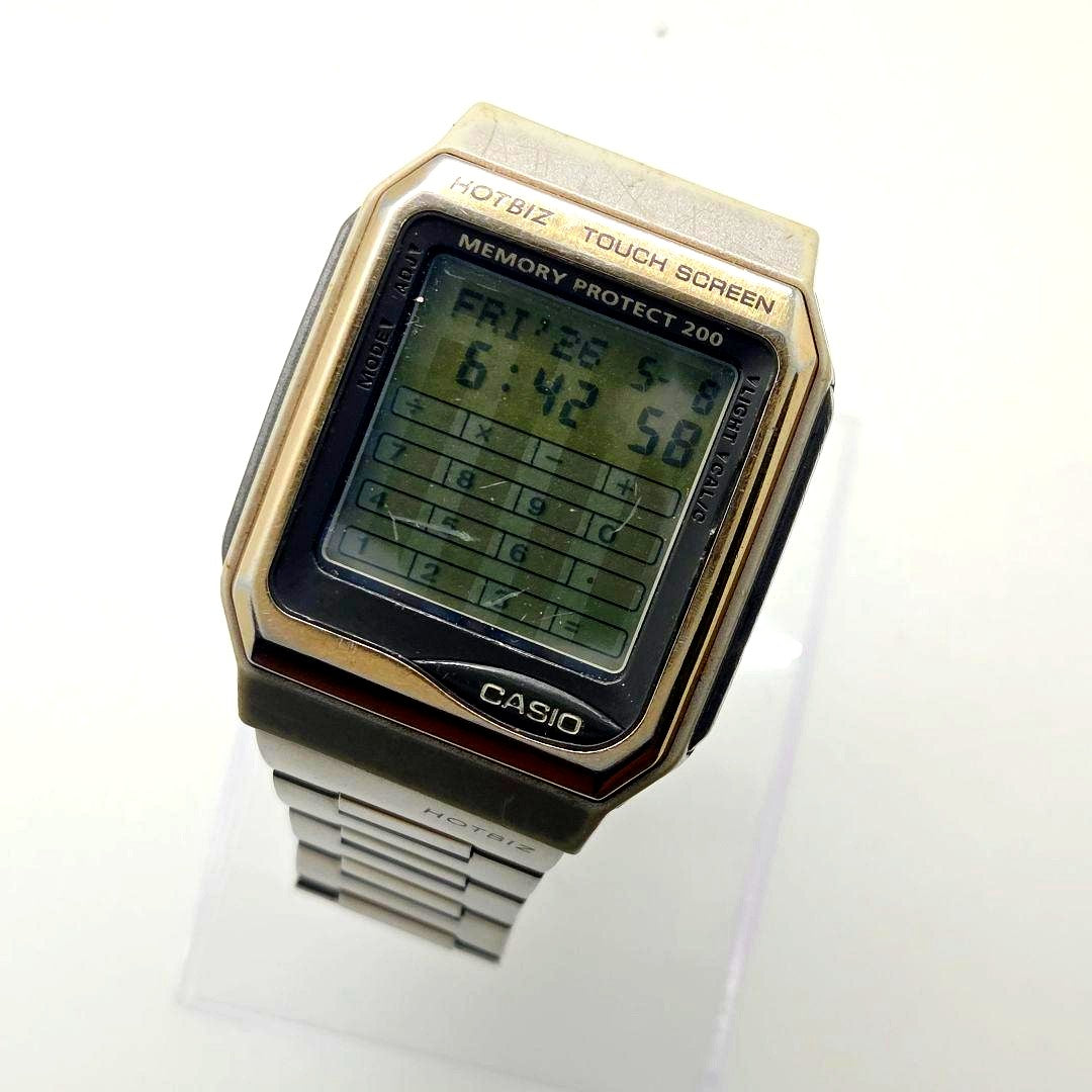 Casio Data Bank Hotbiz VDB-3100 digital clock with touch screen and visible scratches on glass