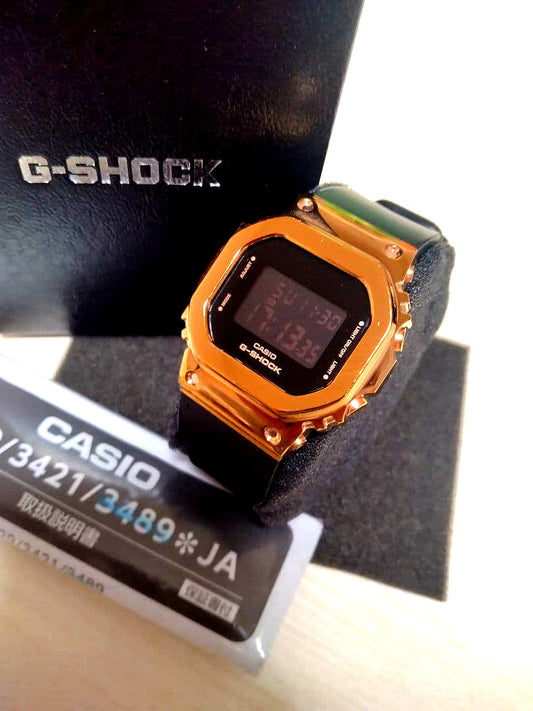 Casio G-Shock GM-S5600PG digital watch in pink gold with rectangular face and metal bezel
