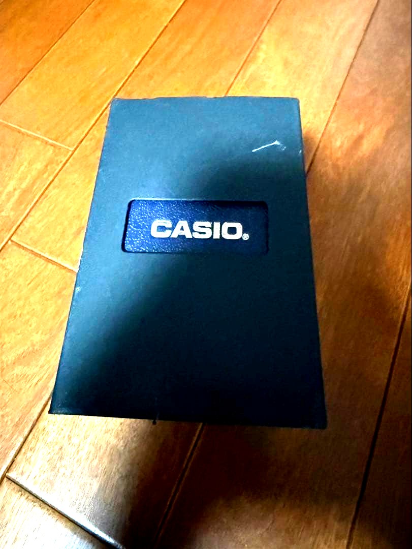 Casio Data Bank Watch Model 5444 5524 with metal band and LCD display showing Japan import