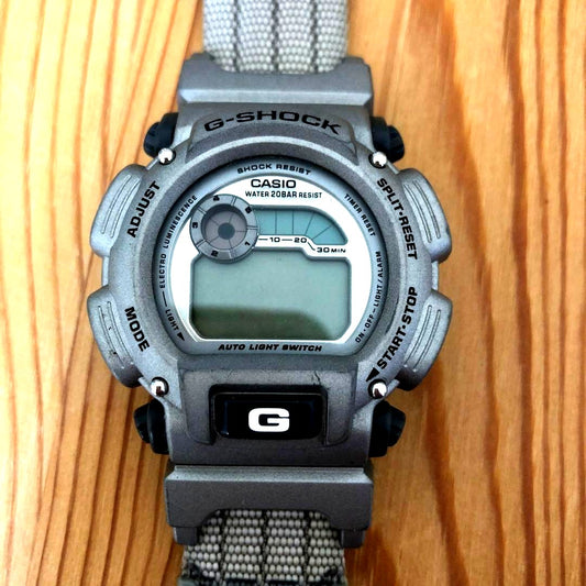 Casio G-Shock DW9000AS-8AT World Cup Limited Model watch with visible scratches and worn band