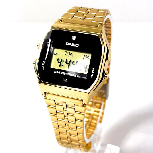 Casio A159WGED-1 gold digital wristwatch with gold front and black band, showing some front scratches