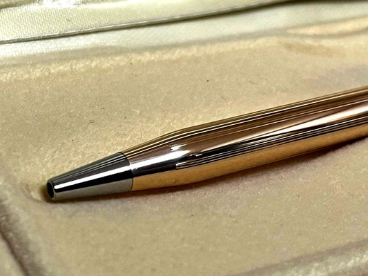 Cross 14K gold plated ballpoint pen with black ink in used condition showing minor scratches