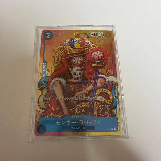Used Monkey D. Luffy OP05 SR Japanese trading card from One Piece series with visible scratches and stored in case