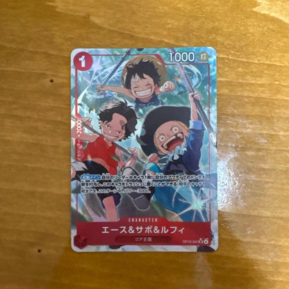 One Piece OP13-057 card featuring Ace, Sabo, and Luffy in SR Parallel rarity