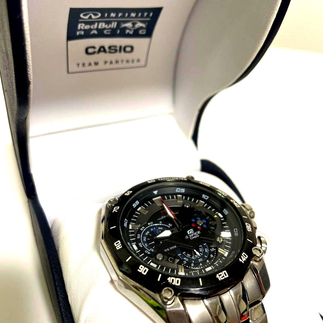 Red Bull Casio Watch Model 5147 with silver round dial and stainless steel band on white background