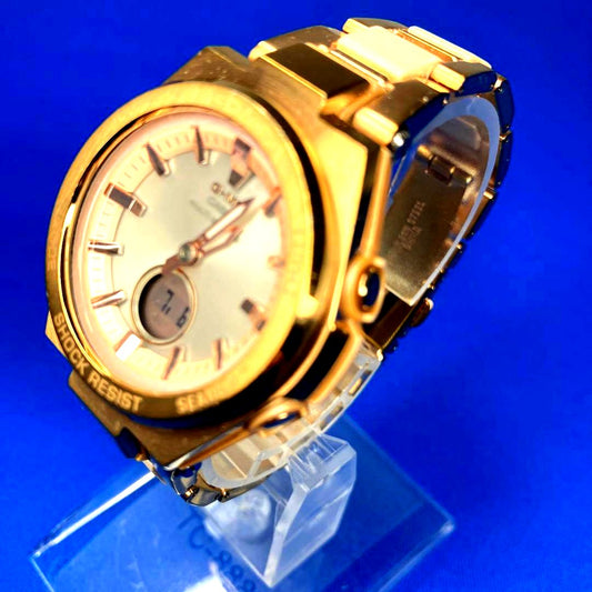 Casio Baby-G MSG-W200CG gold ladies solar radio-controlled watch with stainless steel band on wrist