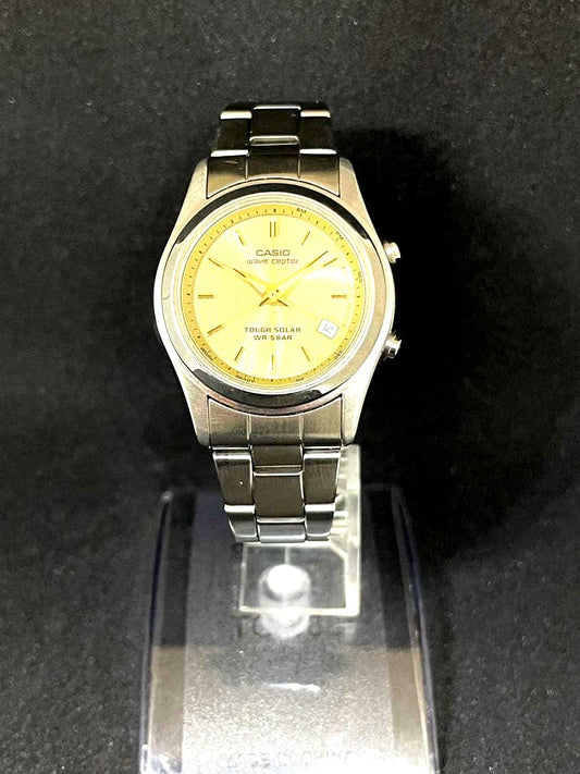 Casio Wave Ceptor WQV-110DJ women's radio solar watch with gold dial and silver band