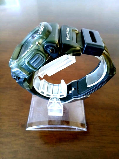 Casio G-Shock DW-9000 digital watch in olive green with shock resistant design and digital display
