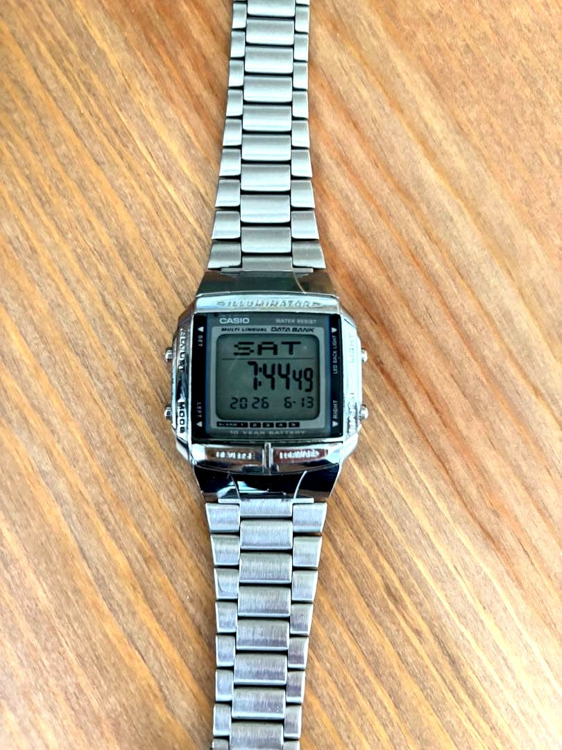 Silver Casio Data Bank DB-360 digital wristwatch with multi lingual display and backlight