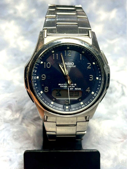 Casio Wave Ceptor Multi Band 5 Radio Solar Watch showing black dial and silver body with minor scratches
