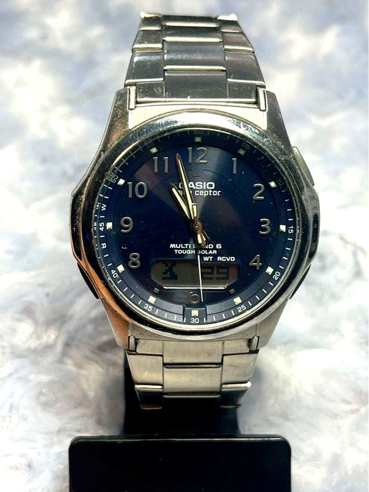 Casio Wave Ceptor Multi Band 5 Radio Solar Watch showing black dial and silver body with minor scratches
