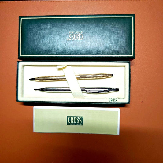 Cross Dual Pen Set featuring gold ballpoint pen and silver mechanical pencil in a sleek black case