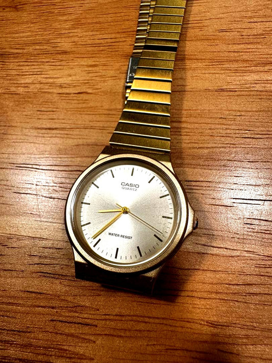 Casio MQ-246-9E gold quartz wristwatch with stainless steel band and water resistance