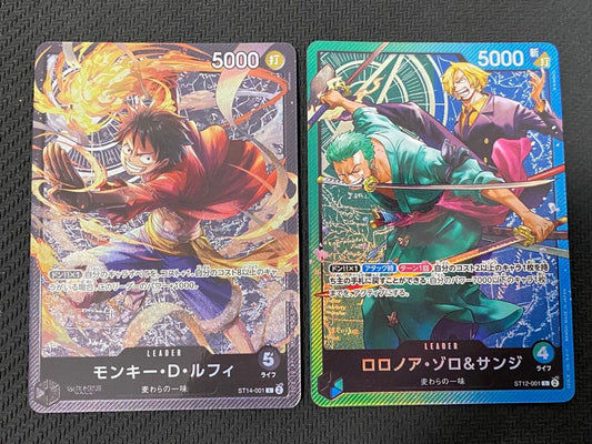 One Piece trading cards featuring Monkey D. Luffy ST14-001 and Zoro & Sanji ST12-001 pirate crew from Japan