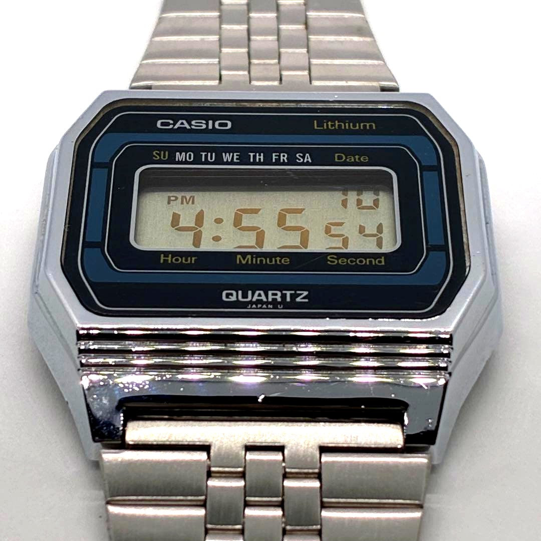 Casio B817 vintage wristwatch showing day and date, with clean case and original strap