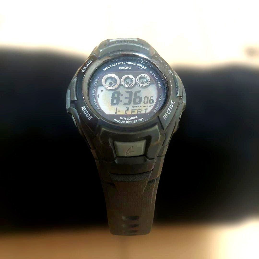 Casio G-Shock GW-500J digital watch with rubber band and visible stopwatch and alarm features