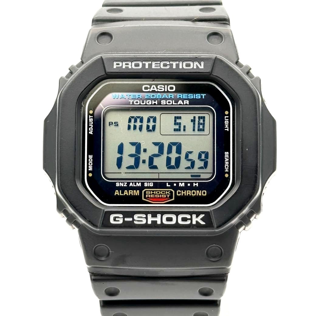 Casio G-Shock G-5600E-1JF solar analog watch in black, showing the face and band