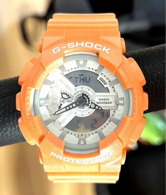 Casio G-SHOCK GA-110SG-4AJF orange watch with matte metallic case and band, white accents on dial and hands