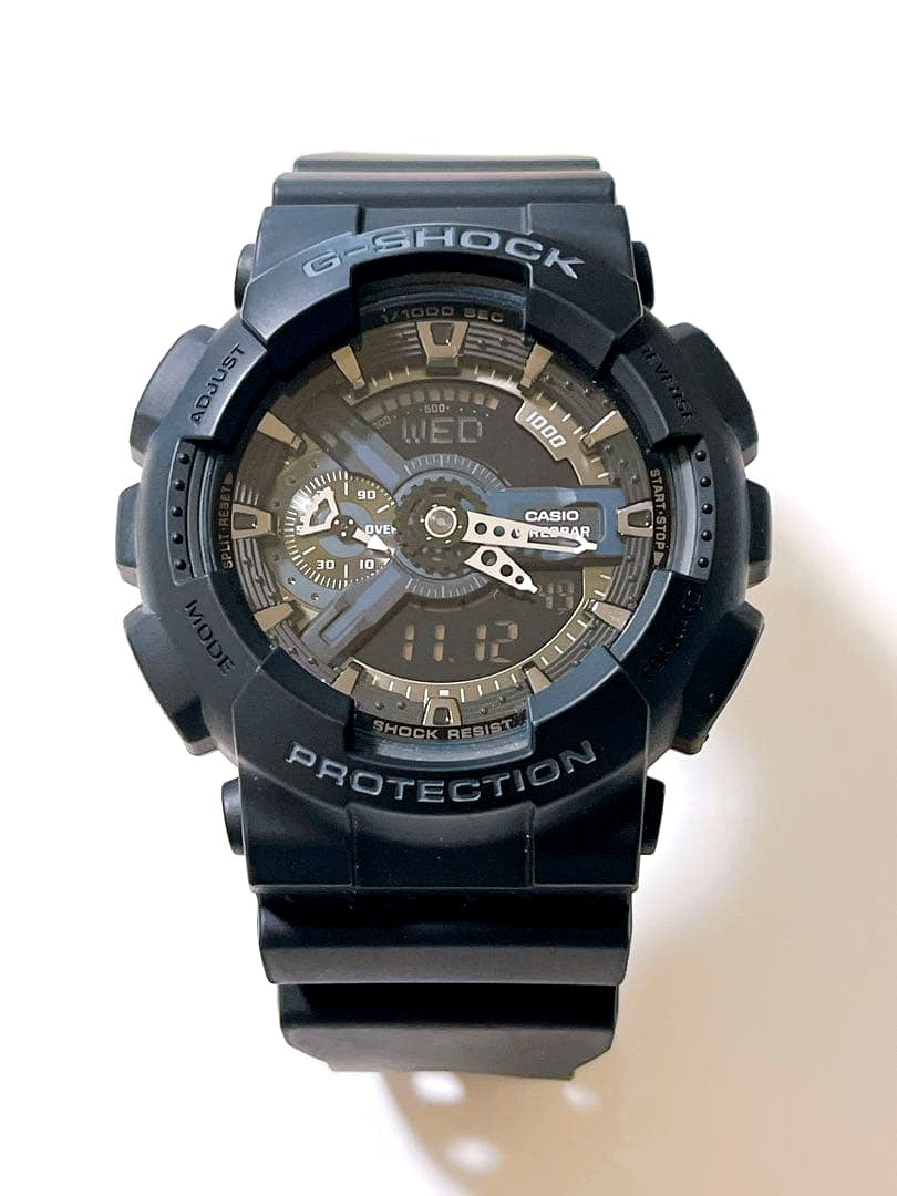 Casio GA-110 1BJF black analog-digital wristwatch showing time and features
