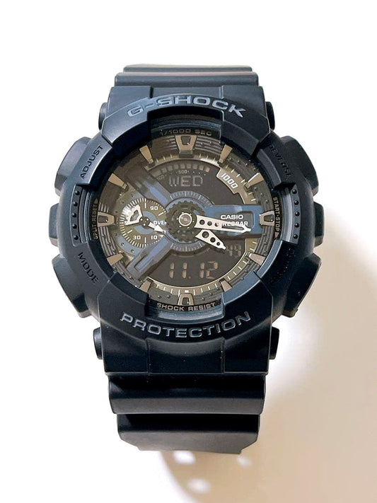 Casio GA-110 1BJF black analog-digital wristwatch showing time and features