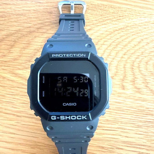 Casio G-Shock DW-5610UU-8JF grey waterproof watch with digital display and durable design