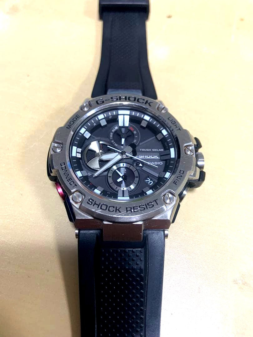 Casio G-Shock GST-B100 Series analog wristwatch with stainless steel case and resin band