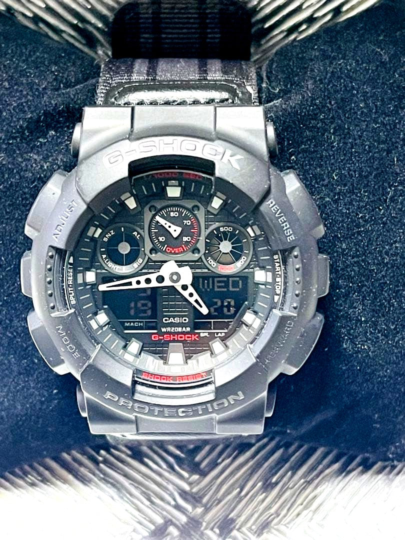 Casio G-Shock GA-100MC black digital analog quartz watch showing face and strap Japan import