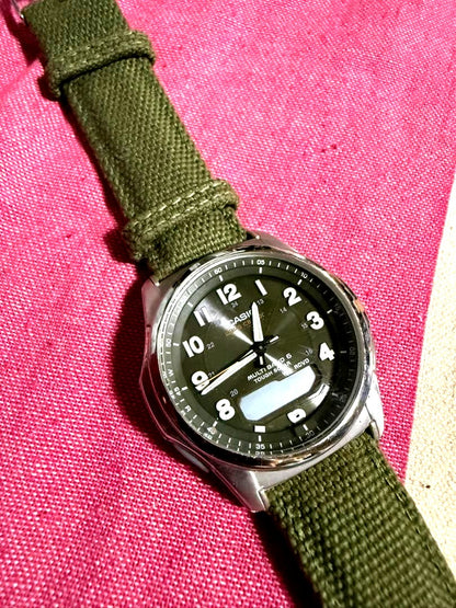 Casio Multiband 6 Series watch with green canvas strap and dark gray dial Japan import