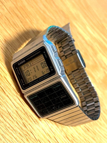 Casio Data Bank DBC-611 vintage calculator watch with digital display and keypad buttons
