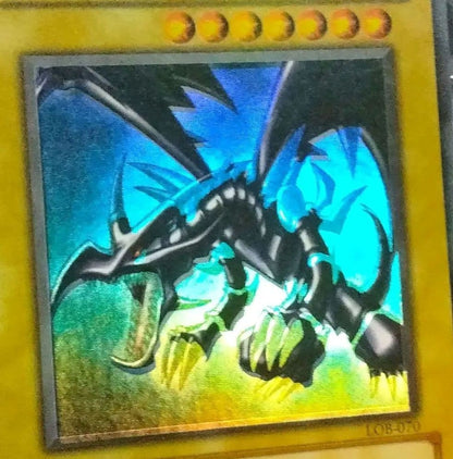 Red Eyes Misprint Error Double Error Card LOB-070 with faded foil shift and white shadow under Red Eyes
