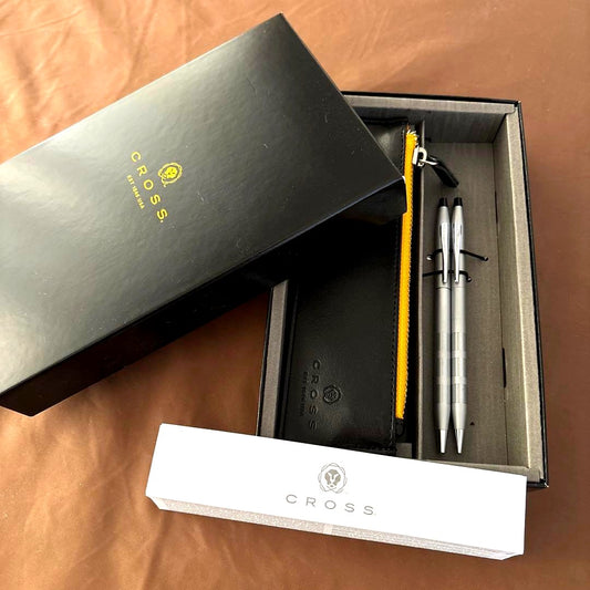 Cross silver ballpoint pen and mechanical pencil set with black leather case and instruction manual