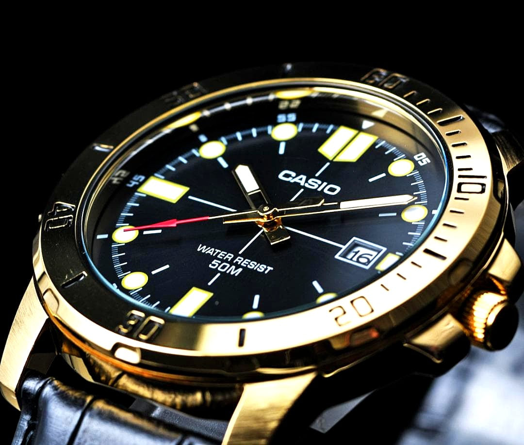 Casio Overseas Model VD01GL-1E black dial men's watch with gold accents and stainless steel case