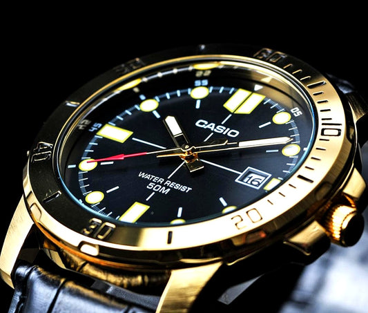 Casio Overseas Model VD01GL-1E black dial men's watch with gold accents and stainless steel case