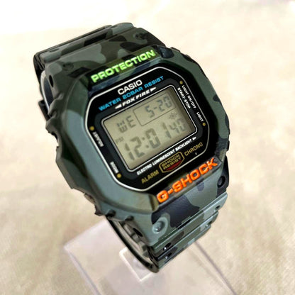 Casio G-Shock DW-5600E watch with new band and bezel showing slight glass scratches
