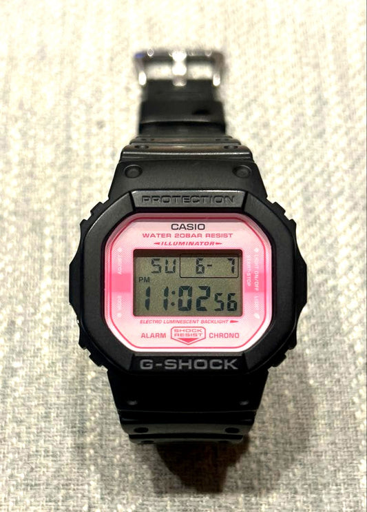 Casio G-Shock DW-5600TCB-1JR Sakura Storm digital watch with black and pink design and alarm feature