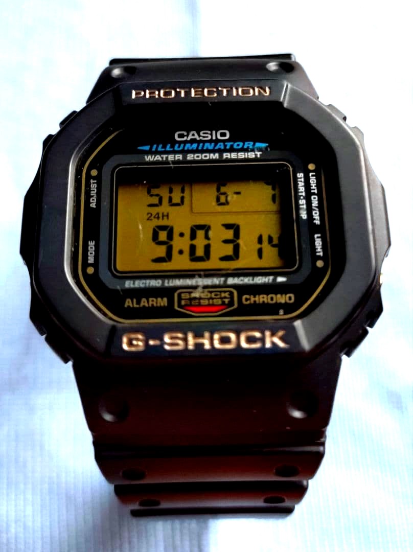 Casio G-Shock DW-5600E watch with gold LCD screen and gold buttons, overseas edition model 1545