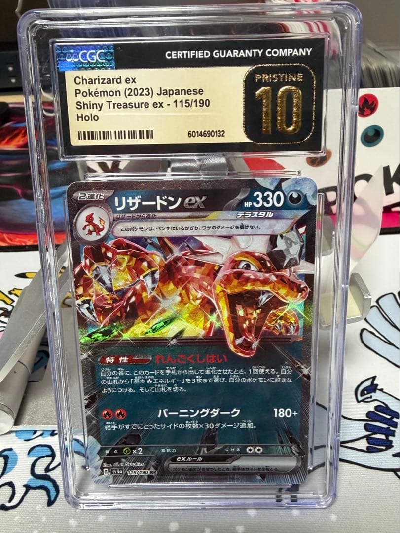 Charizard ex trading card graded CGC 10 with pristine condition, showing front artwork and grade label