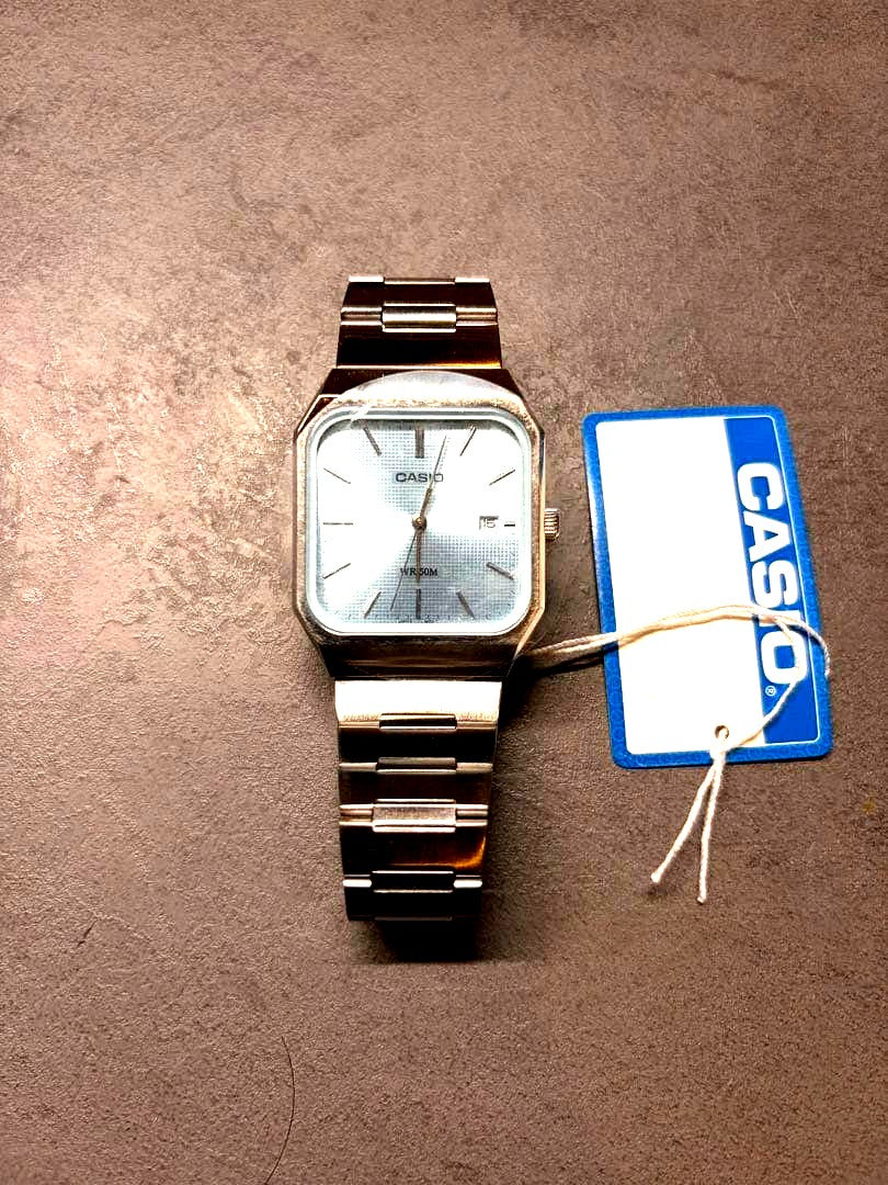 Casio MTP-B185D square wristwatch in ice blue and silver stainless steel with Japanese manual