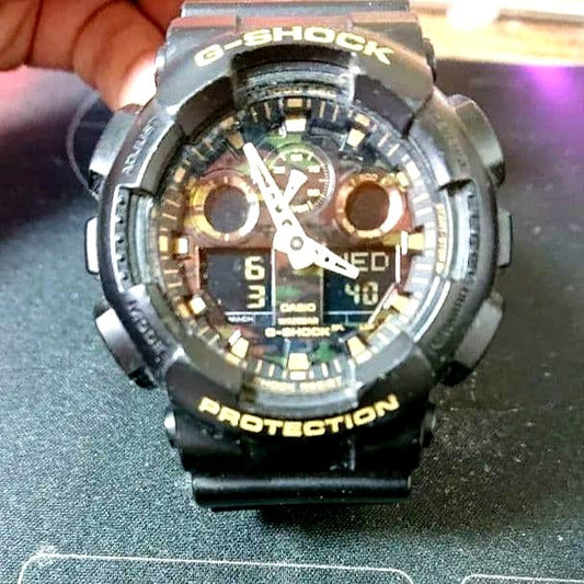 Casio G-Shock GA-100CF watch with camouflage dial and magnetic resistance, analog-digital display