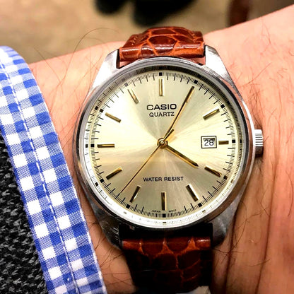 Casio analog wristwatch with 18mm champagne gold leather band and quartz movement