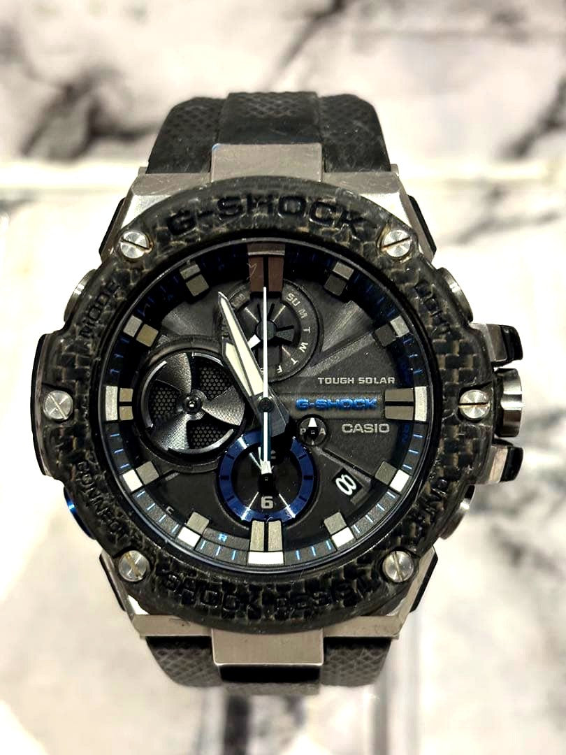 Casio G-Shock G-Steel GST-B100 model watch with black and silver design, shown from front angle
