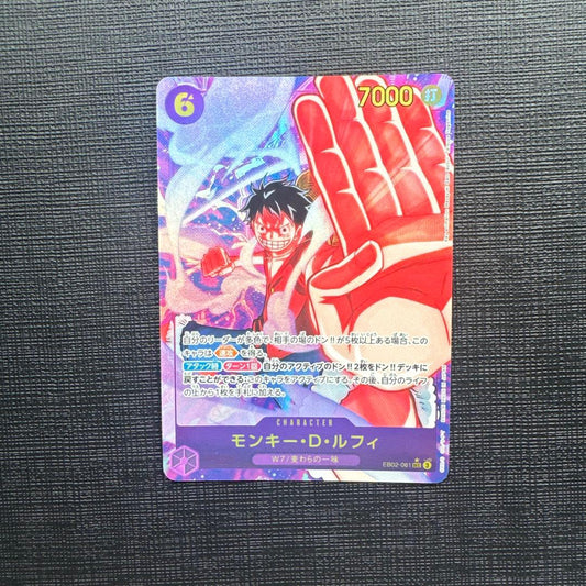 One Piece Monkey D. Luffy SEC Parallel EB02-061 trading card with slight scuffing and two small chips