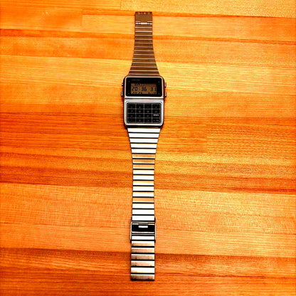 Casio Data Bank DBC-611 silver digital watch featuring a calculator and digital display